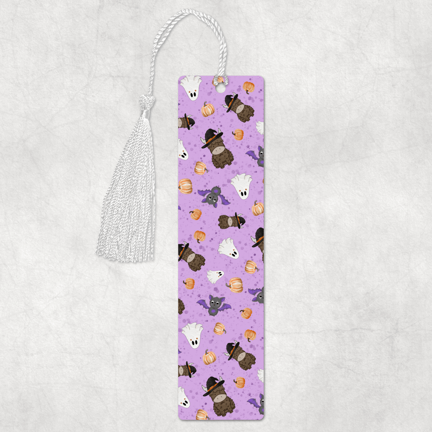 Purple bookmark with cartoon animal designs on a light gray background halloween highland cow theme