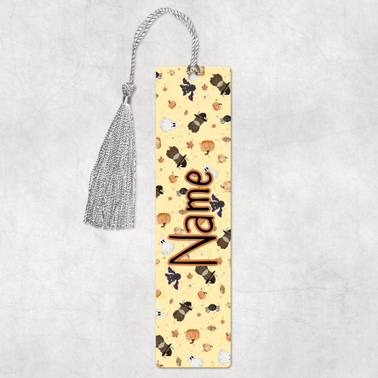 Hand drawn Halloween theme highland cow bookmark with orange background, personalised by Moose and Goose Gifts