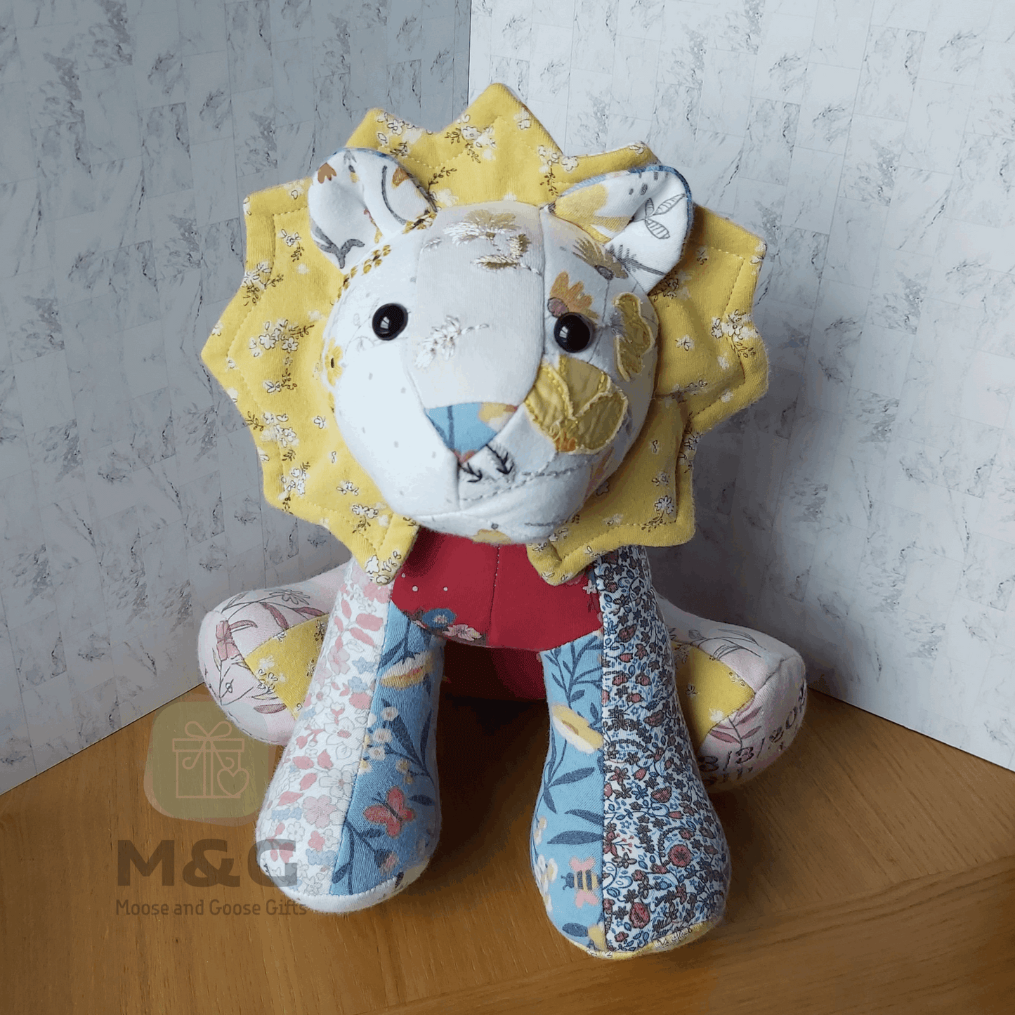 Handmade keepsake lion made from baby or loved one clothing - Front view
