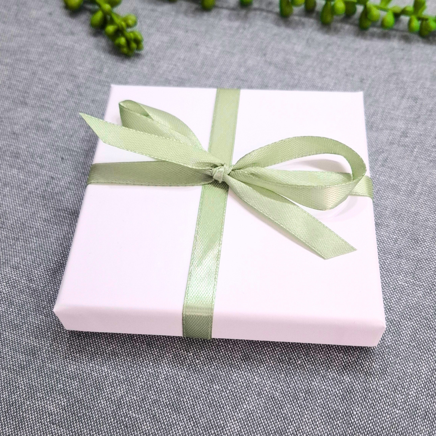 white gift box for personalised photo coaster with ribbon
