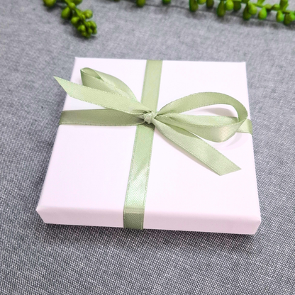 white gift box for personalised photo coaster with ribbon