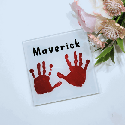 Childs handprint printed on to a glass square coaster