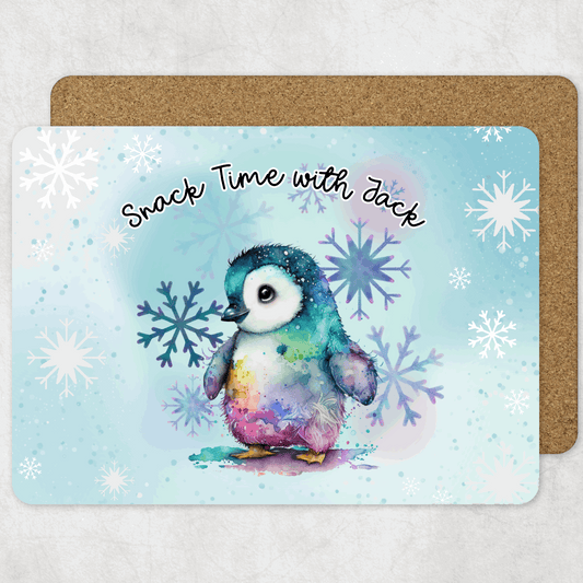 Colourful penguin placemat with snowflakes and 'Snack Time with Jack' text on a light blue background.